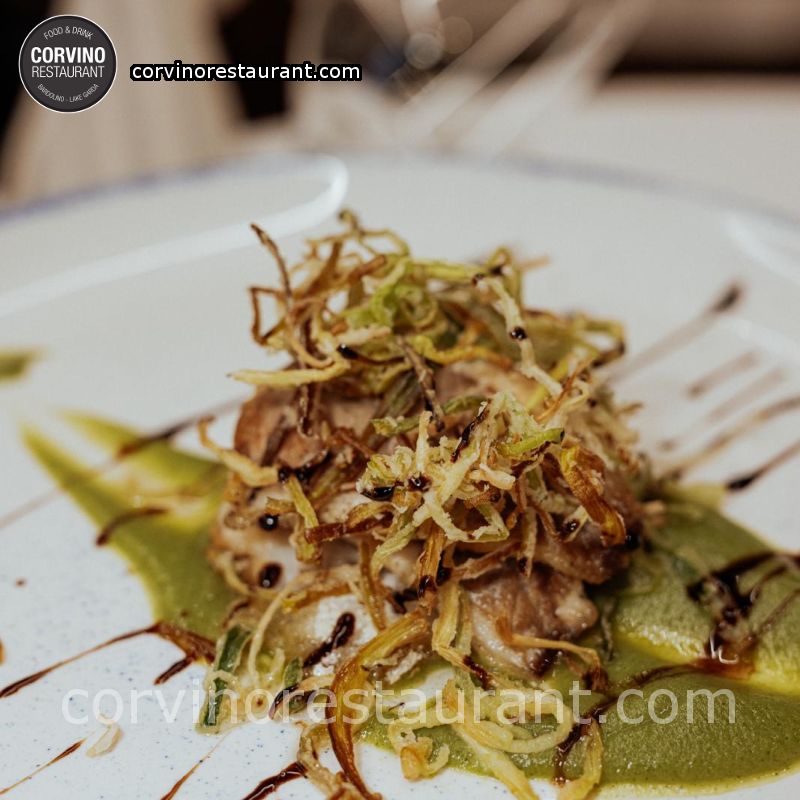 Sea bass millefeuille with fried leek on a cream of courgettes Sea bass millefeuille with fried leek on a cream of courgettes